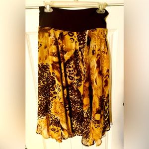 Like NEW! Never worn! Pull-on skirt, animal print, hits mid-calf
